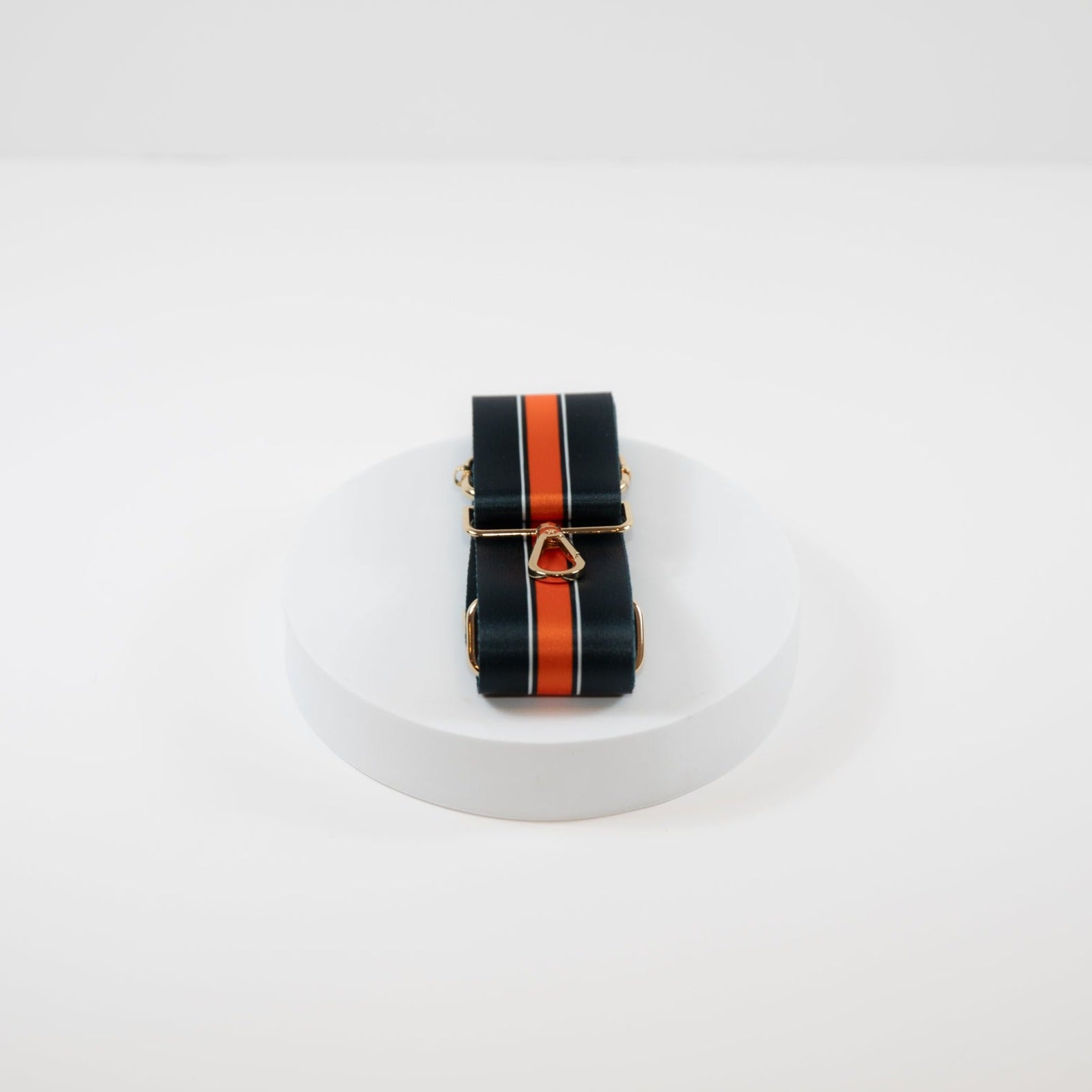 Elegant crossbody strap shown in Chicago Bears team colors