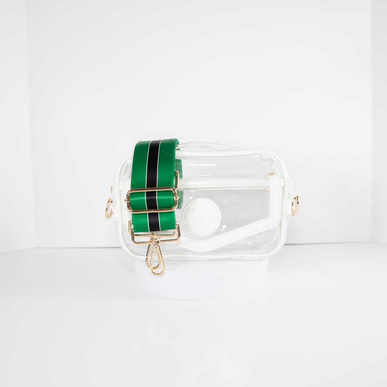 Clear stadium bag with white leather trim, front facing, with a crossbody strap in Philadelphia Eagles colors.