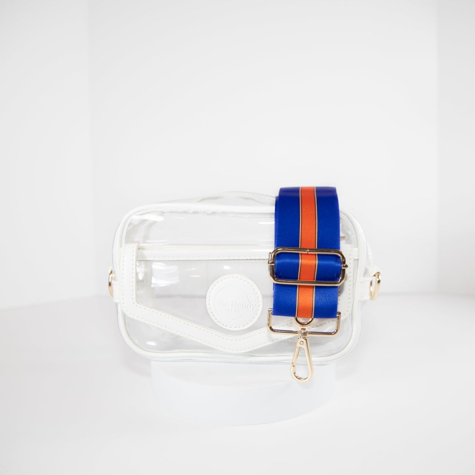 Clear stadium bag in white leather trim, front facing, with a crossbody strap in University of Florida Gators team colors.