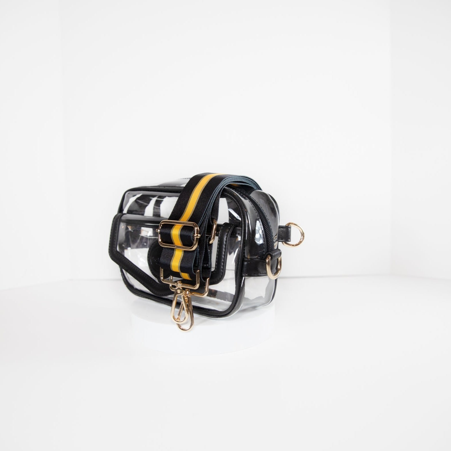 Clear stadium bag in black leather trim, side facing, with a crossbody strap in Pittsburgh Steeler black and gold.