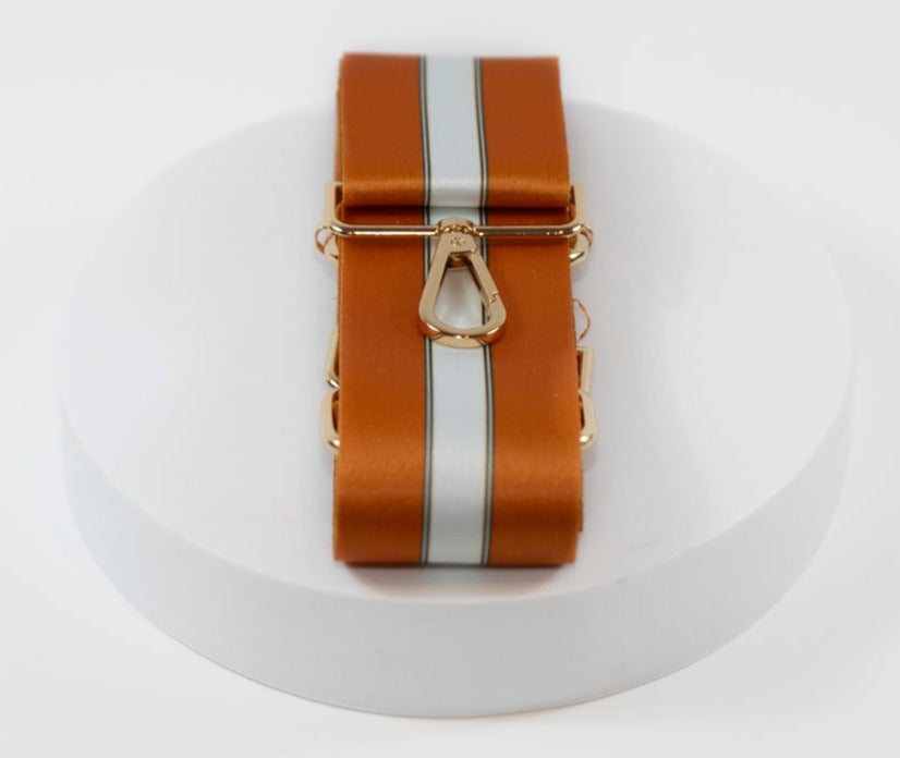 Elegant crossbody strap in team colors of the University of Texas Longhorns orange and white.